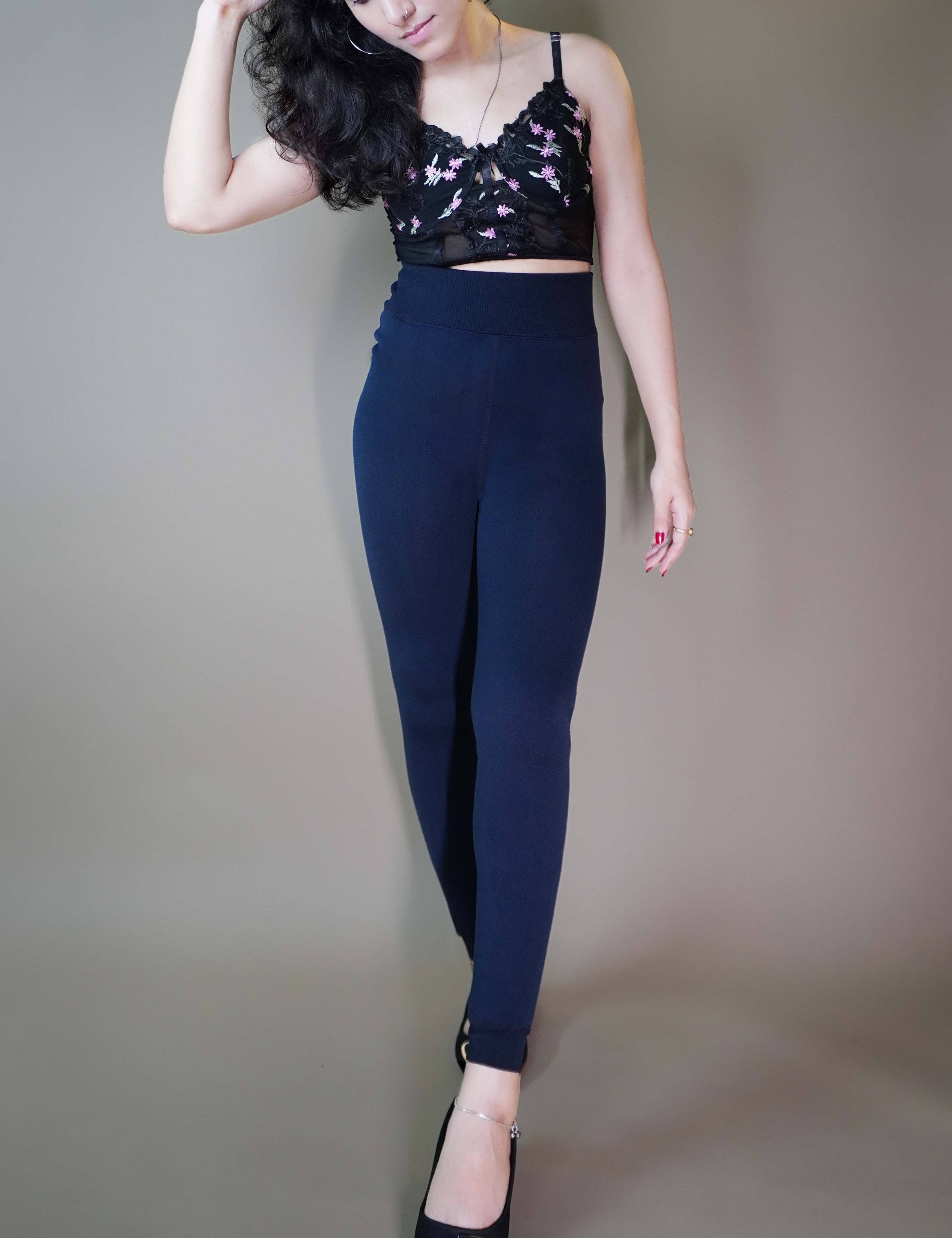 A beautiful model elegantly flaunting dark blue furry tights, highlighting their luxurious texture and unmatched warmth-Muselot