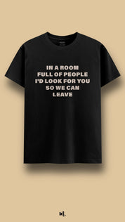 Black graphic t-shirt showcasing the “In a Room Full of People I’d Look for You So We Can Leave” statement, highlighting a soft, couple-focused mood against a clean, minimal beige background – Muselot