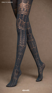Close-up of crossed legs in Intense Grey designer lace stockings with ornate scalloped motifs, semi-sheer texture and closed feet - Muselot