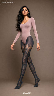 A woman wearing Smoky Grey patterned pantyhose with intricate designer lace motifs and elegant waist-to-toe coverage - Muselot