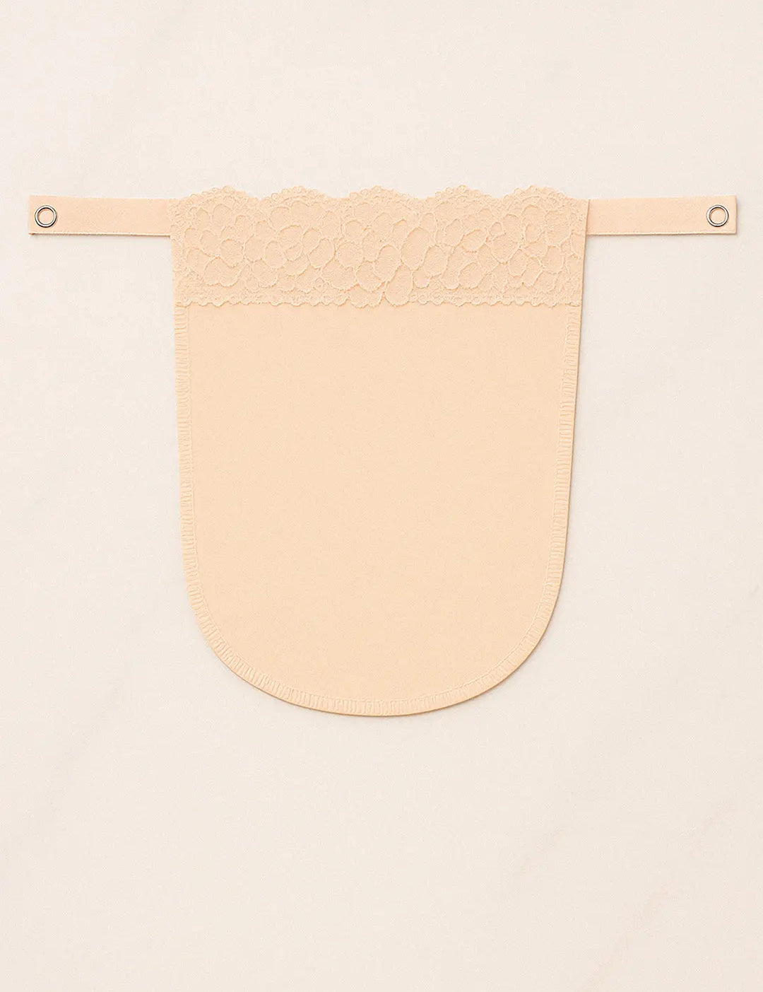 Beige solid mocker modesty panel in flatlay view, displaying intricate lacework and secure clip design for graceful deep-neck coverage — Muselot.