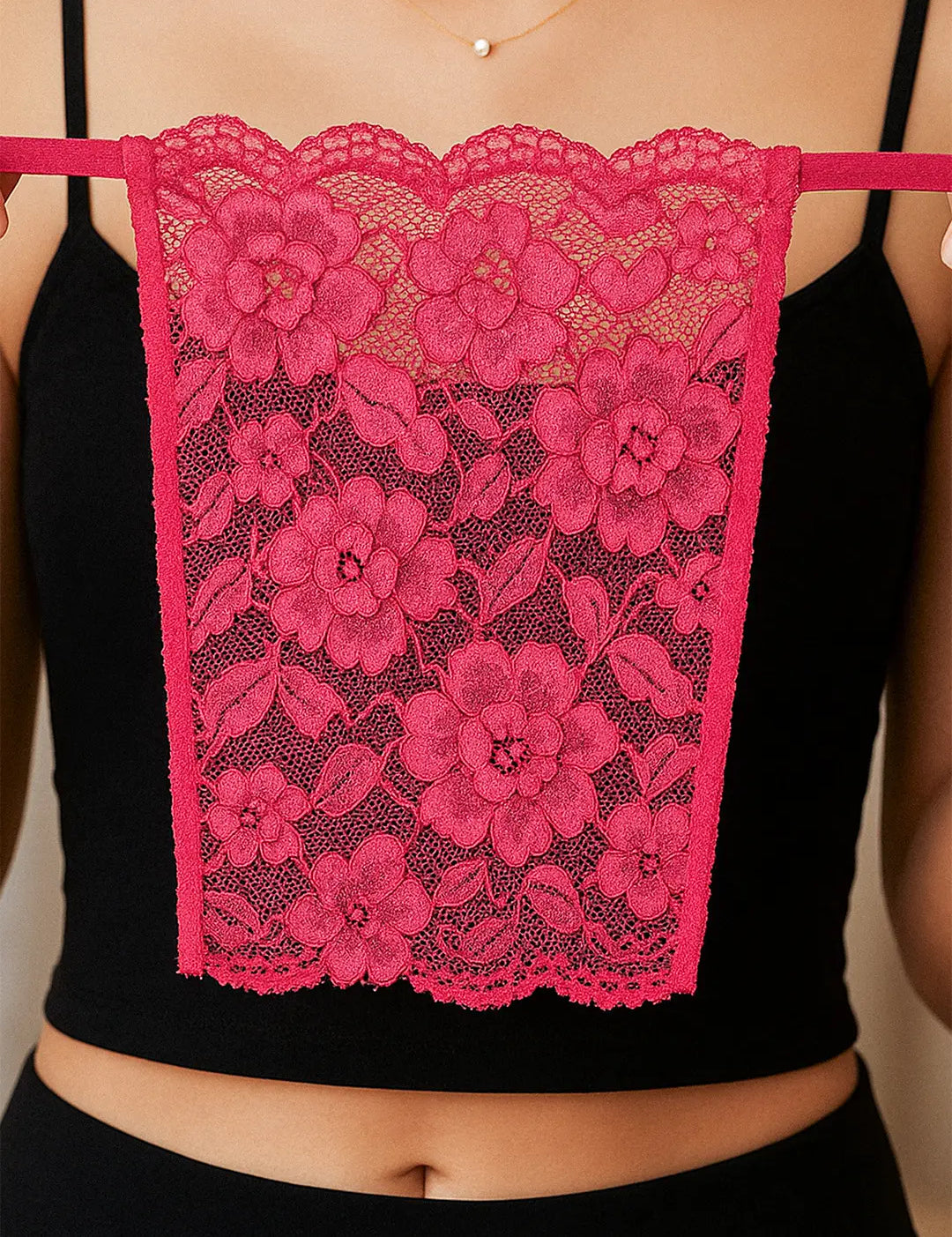 Close-up of model holding Lacy Magenta Mockers, highlighting the vibrant lace texture and stylish design for enhancing deep-neck outfits – Muselot.