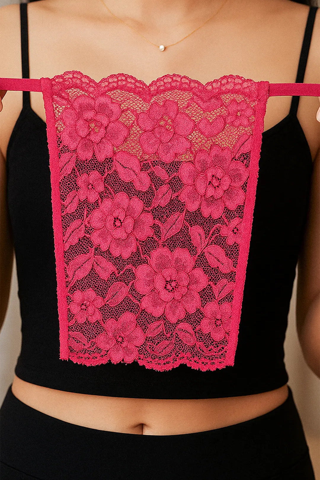Close-up of model holding Lacy Magenta Mockers, highlighting the vibrant lace texture and stylish design for enhancing deep-neck outfits – Muselot.