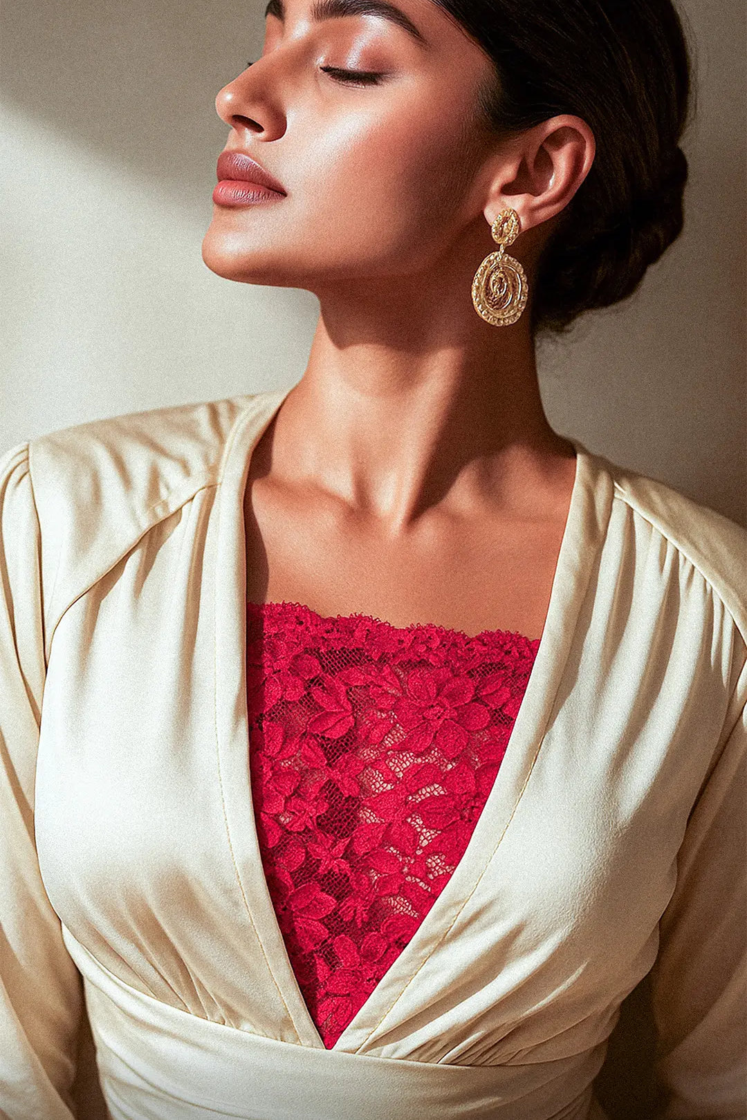Sunlit shot of model wearing Lacy Red Mockers with a beige dress, highlighting the rich lace texture and elegant contrast for deep-neck styles – Muselot.