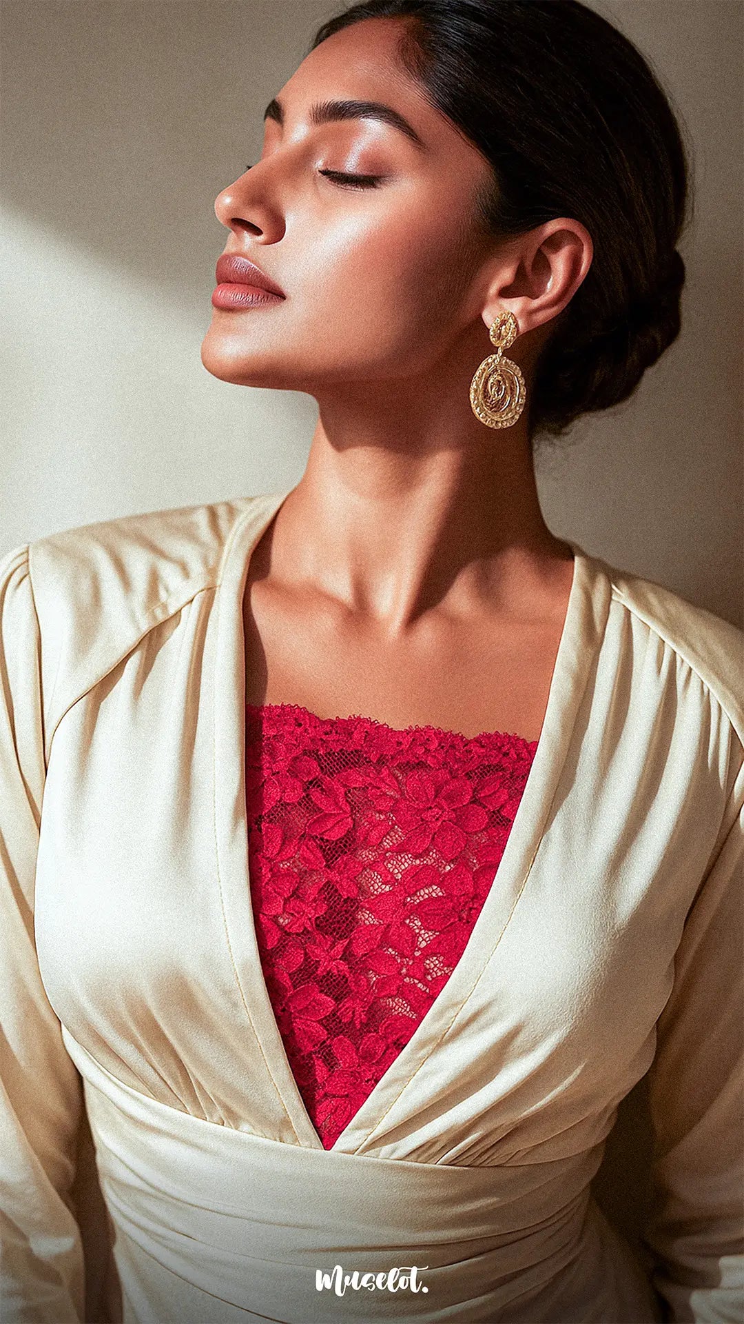 Sunlit shot of model wearing Lacy Red Mockers with a beige dress, highlighting the rich lace texture and elegant contrast for deep-neck styles – Muselot.