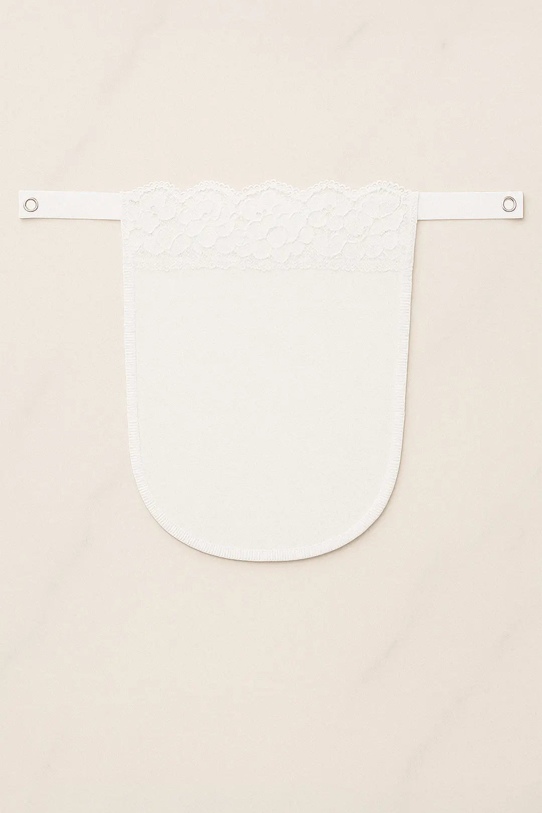 White lace mocker modesty panel in flatlay view, showcasing delicate floral lace design and secure clip fastening for elegant deep-neck coverage — Muselot
