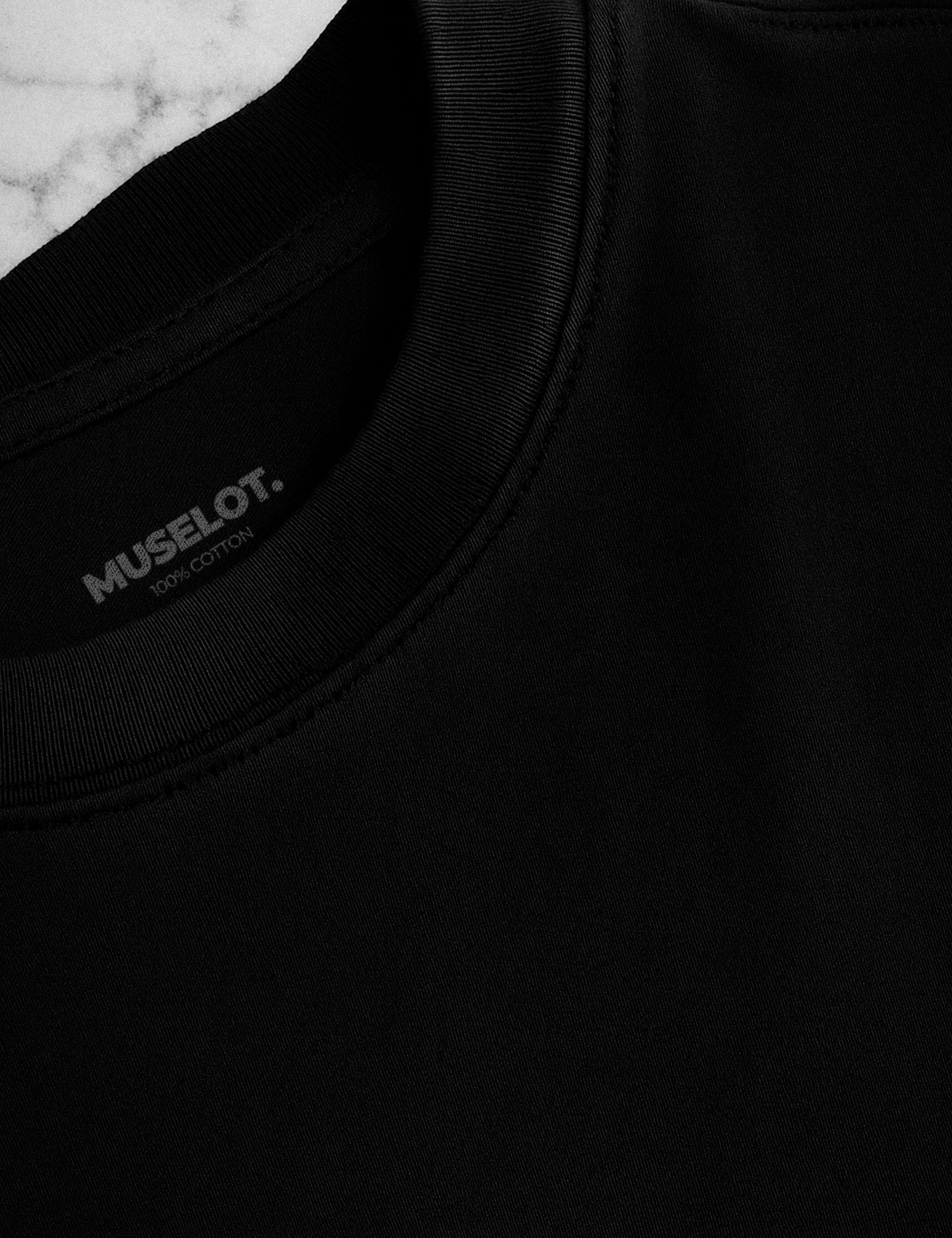 Close-up shot of the neckline of a unisex oversized black t-shirt, showcasing the detailed stitching and subtle logo, emphasizing its premium design and quality craftsmanship-Muselot