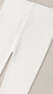 A close-up of non-slip waistband white opaque tights, highlighting secure fit, reinforced stitching, and premium comfort design - Muselot
