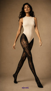 A full-length view of woman wearing Royal Black designer lace stockings with ornate semi-sheer pattern from waist to closed toe - Muselot