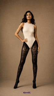 A woman standing in black designer lace tights featuring decorative floral bands, semi-sheer sections and full-leg coverage - Muselot