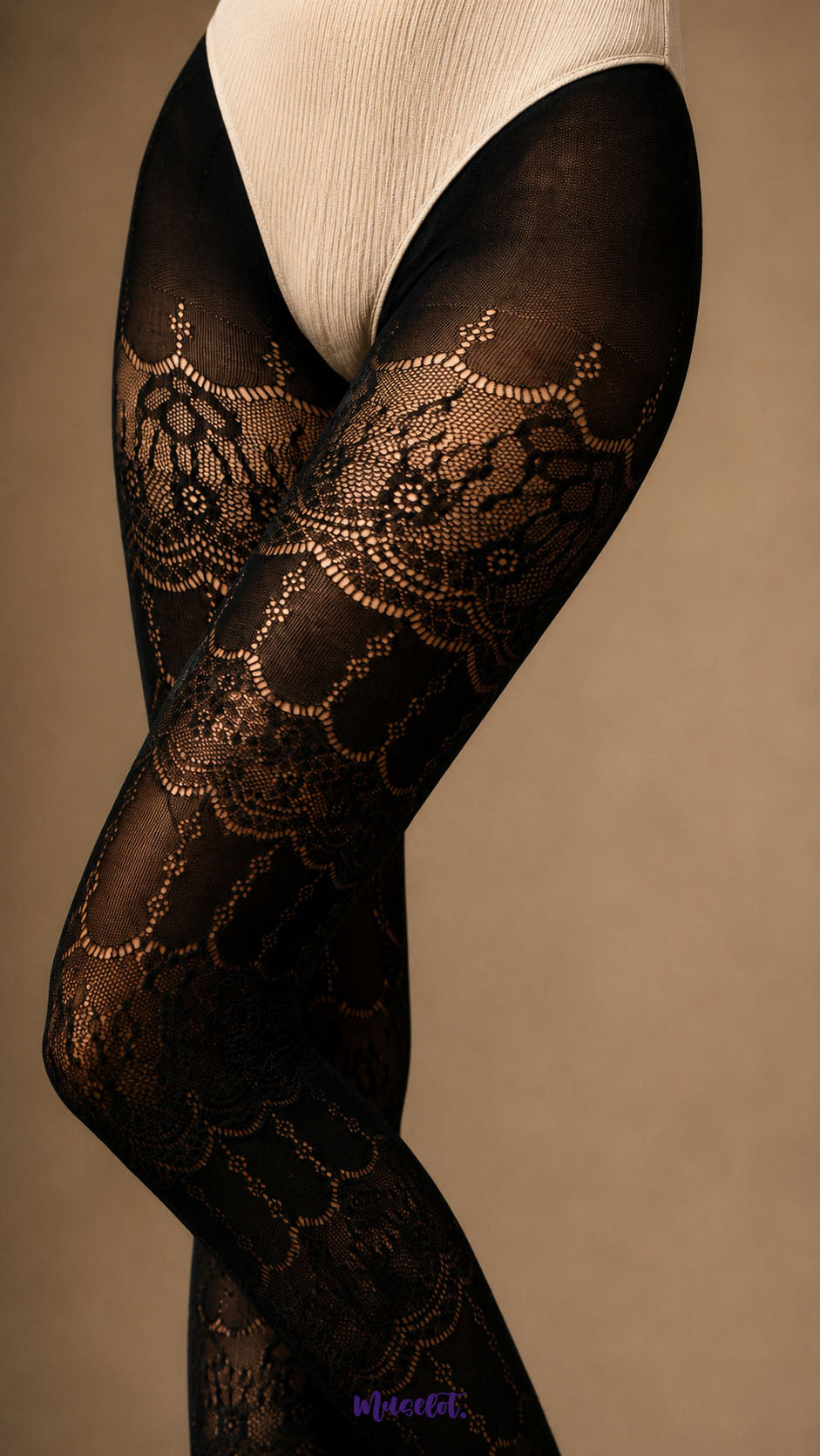 Close-up of Royal Black lace pantyhose highlighting detailed floral and scalloped lace motifs across the thighs and legs - Muselot