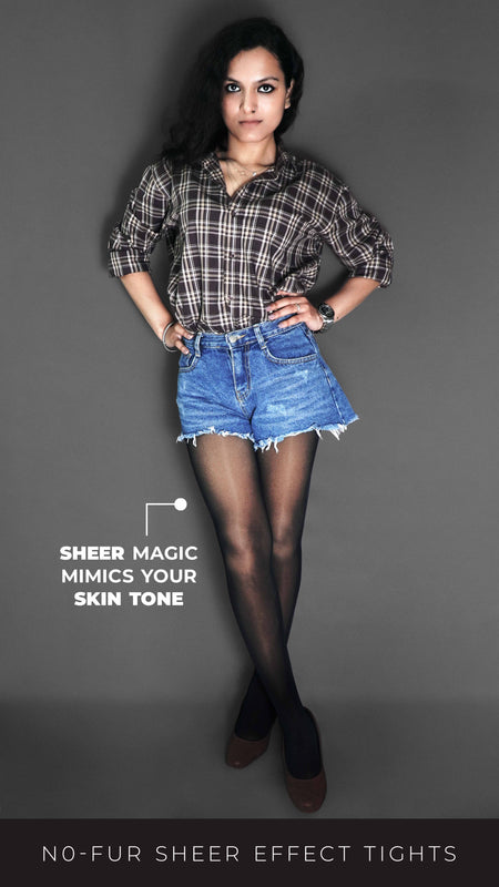 A model wearing black sheer tights for women, posing with her hands on her waist, showcasing the smooth transparent material-Muselot
