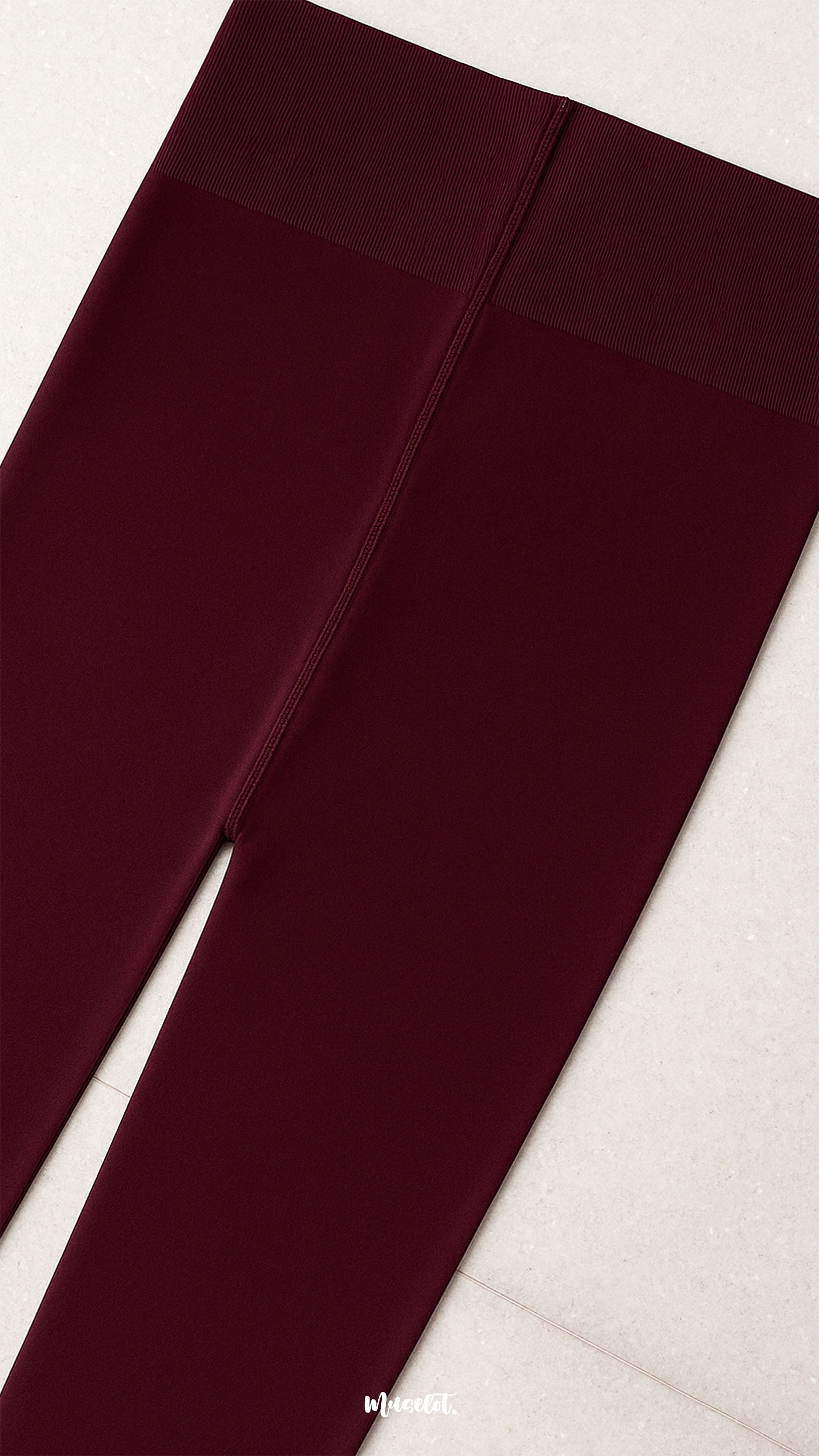 Close-up of snug-fit waistband on semi-opaque maroon tights, highlighting secure hold, stretch comfort, and premium finish - Muselot