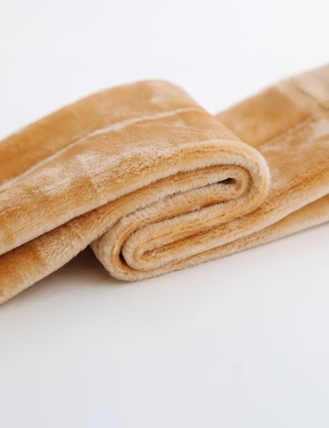 A zoomed in shot of the inside of the thermal beige socks, showcasing the ultra-soft, plush fur for maximum warmth and comfort. The thick, insulating faux fur provides a cozy feel, perfect for cold weather-Muselot