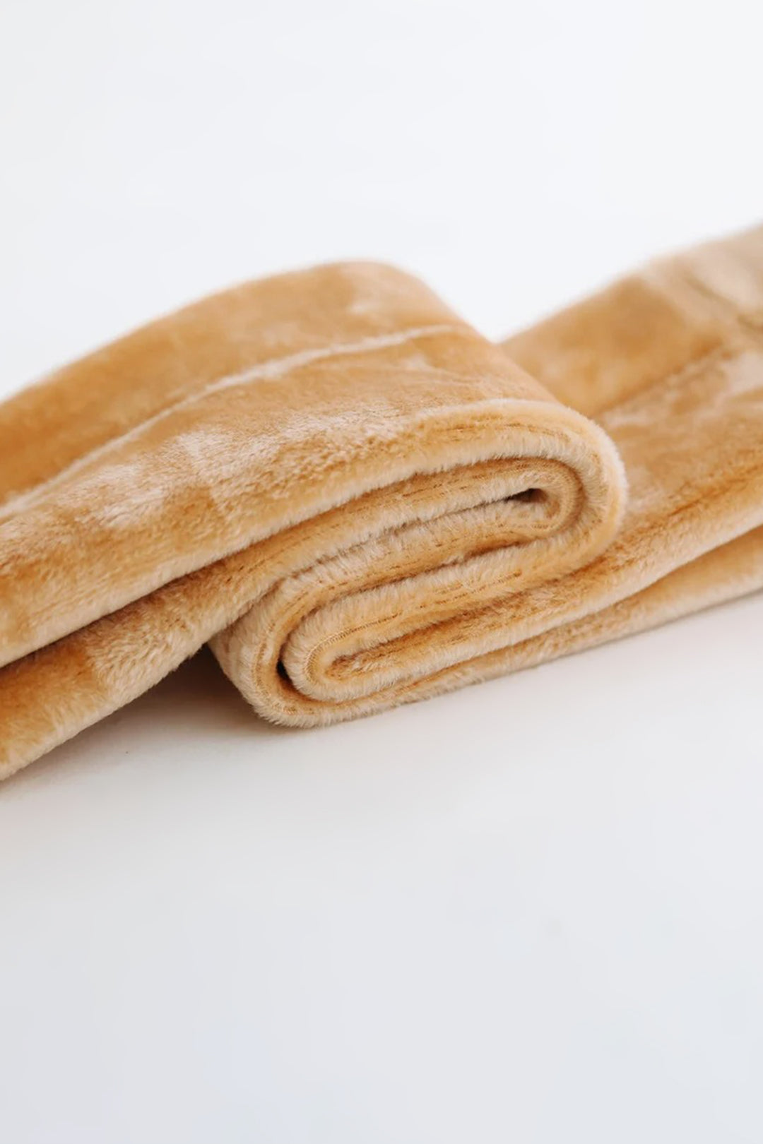 A zoomed in shot of the inside of the thermal beige socks, showcasing the ultra-soft, plush fur for maximum warmth and comfort. The thick, insulating faux fur provides a cozy feel, perfect for cold weather-Muselot