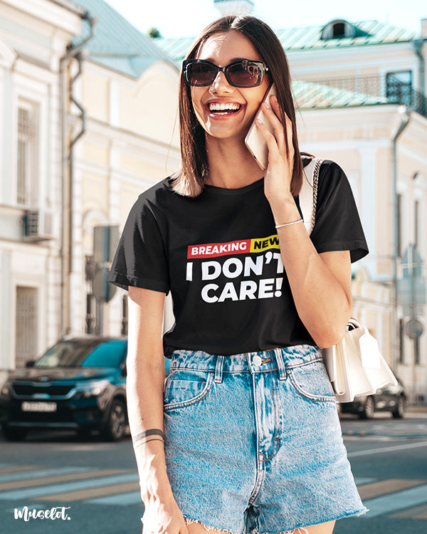 Breaking news I don't care printed t shirts for men and women in black colour