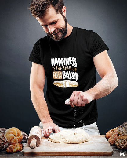 Black t shirt printed with Happiness is smell of freshly baked bread for baking lovers.