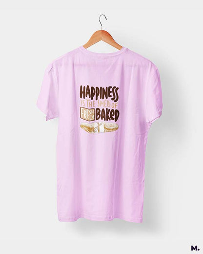 Light pink t shirt printed with Happiness is smell of freshly baked bread for baking lovers.