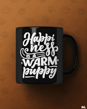 Black printed mugs online for pet lovers - Happiness is a warm puppy  - MUSELOT