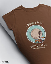 Beauty is in the chai of the beholder printed t shirts by Muselot in coffee brown colour 