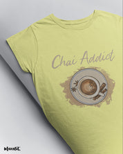 Chai addict illustrated printed t shirt in butter yellow colour for men and women who love tea by Muselot