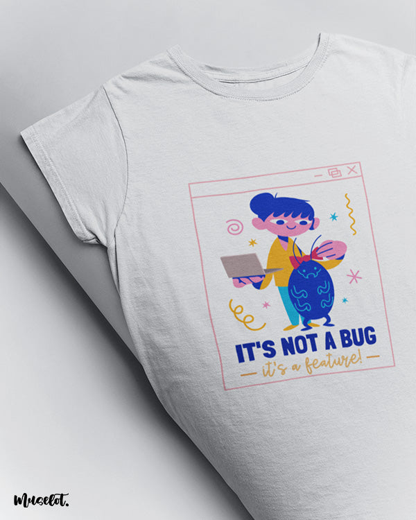 It's not a bug, it's a feature design illustrated graphic t shirt in white colour for coders at Muselot