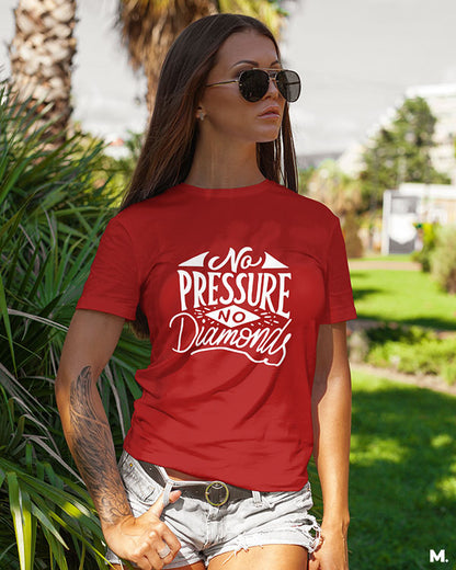 Female model wearing red t-shirt printed with "no pressure, no diamonds" which is a famous quote by Thomas Carlyle.